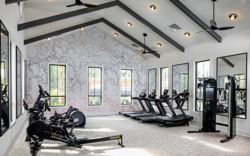 a room with a bike and benches
