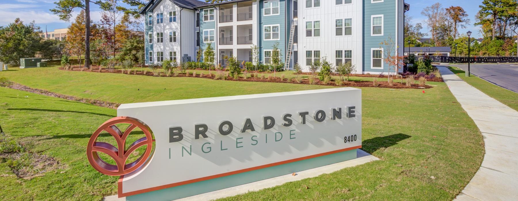 a sign in front of a building