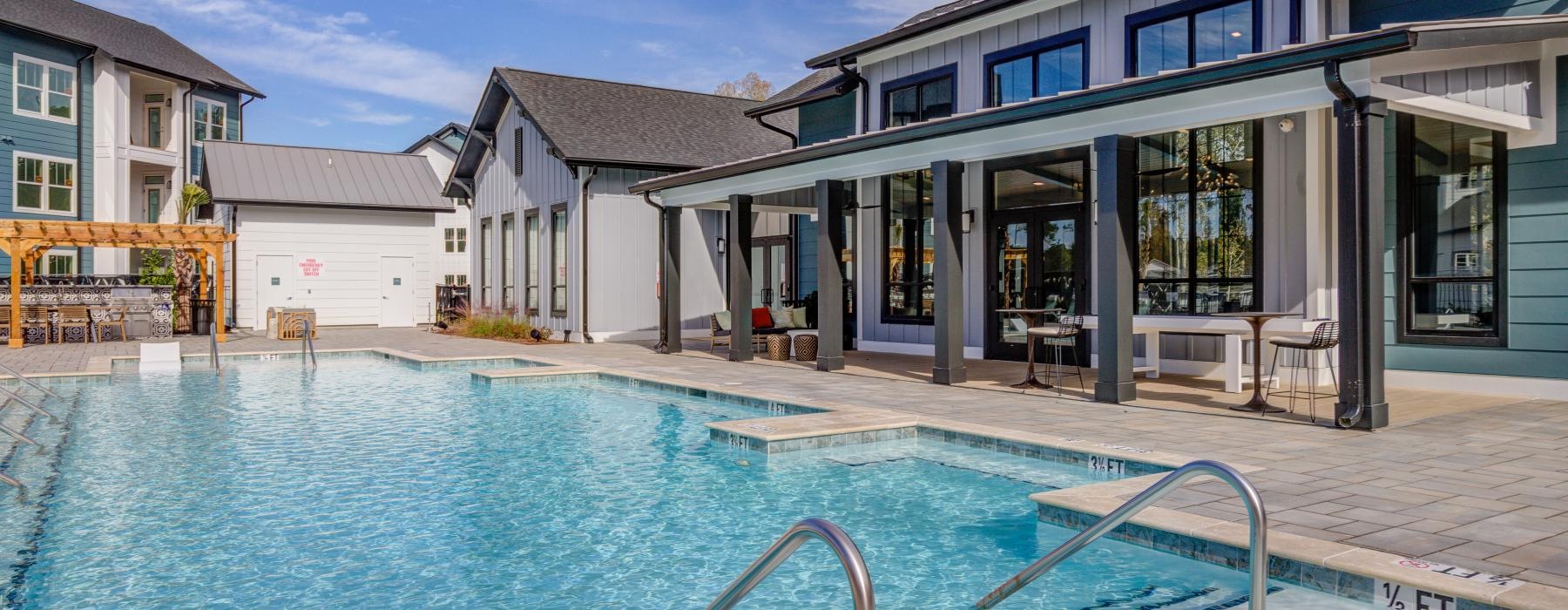 a swimming pool with a building in the background