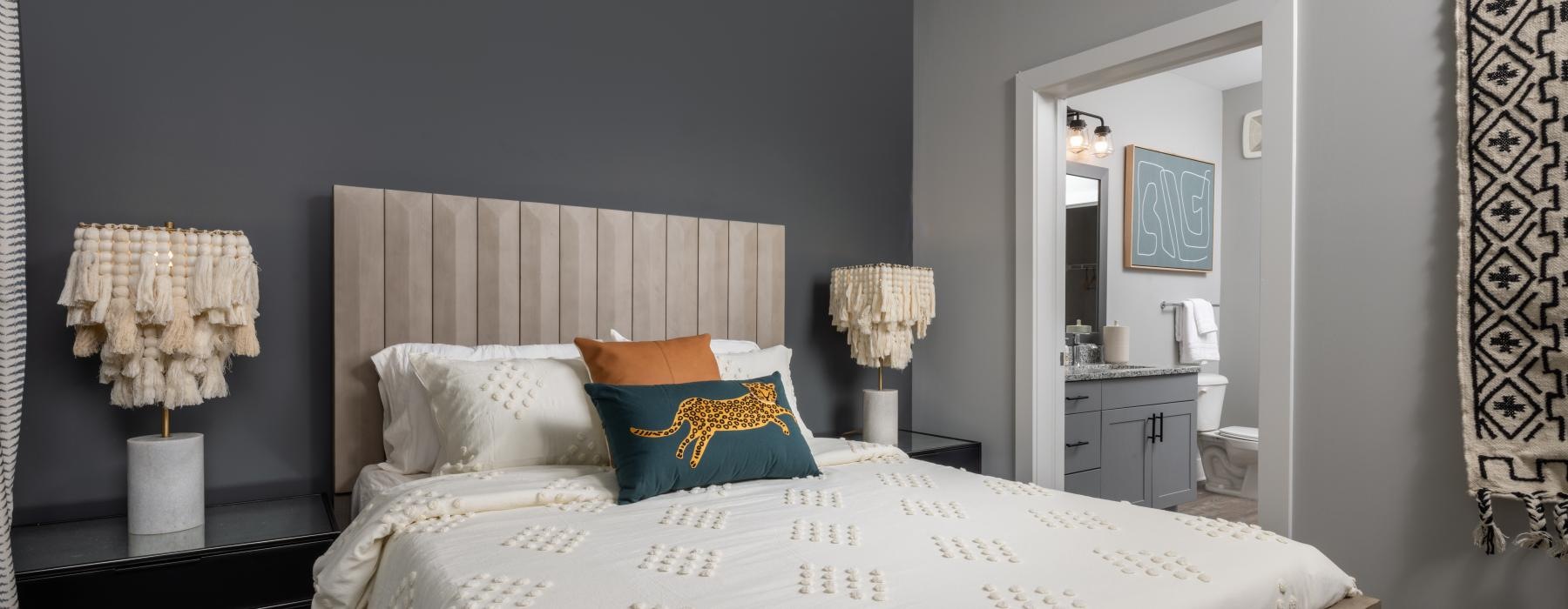 a bed with a white bed spread